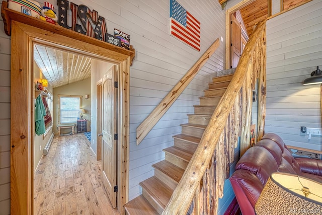 10199 W Cheyenne Cir, Salida, CO 81201 - stairs featuring wood walls, lofted ceiling, and wood-type flooring
