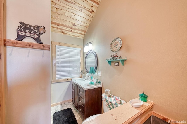 10199 W Cheyenne Cir, Salida, CO 81201 - bathroom with vanity, wooden ceiling, baseboards, and vaulted ceiling