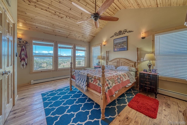 10199 W Cheyenne Cir, Salida, CO 81201 - bedroom with a baseboard heating unit, wooden ceiling, hardwood / wood-style flooring, high vaulted ceiling, and a ceiling fan