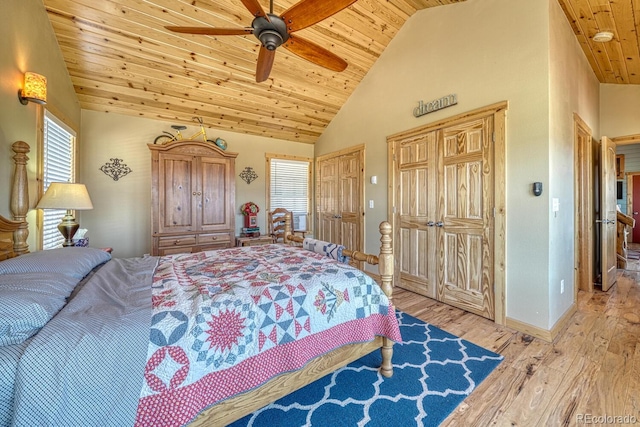 10199 W Cheyenne Cir, Salida, CO 81201 - bedroom with wooden ceiling, hardwood / wood-style floors, multiple closets, high vaulted ceiling, and baseboards