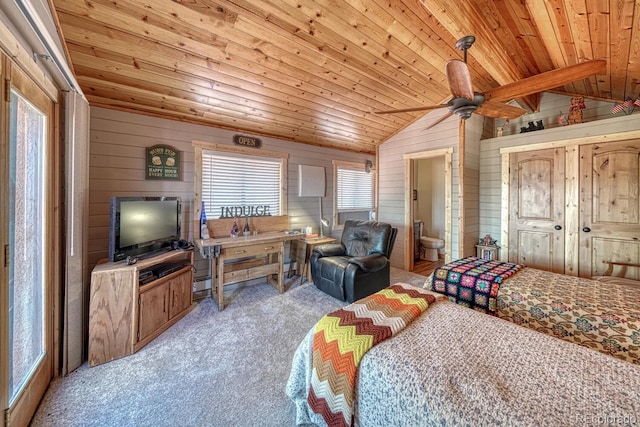 10199 W Cheyenne Cir, Salida, CO 81201 - carpeted bedroom with vaulted ceiling, wood ceiling, wooden walls, ensuite bathroom, and ceiling fan