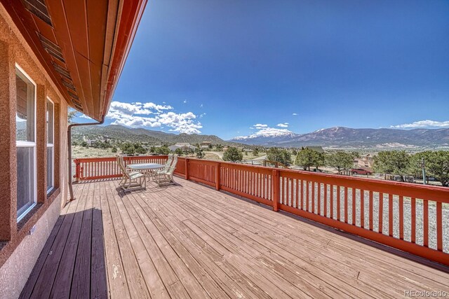 10199 W Cheyenne Cir, Salida, CO 81201 - wooden terrace featuring a mountain view and outdoor dining area