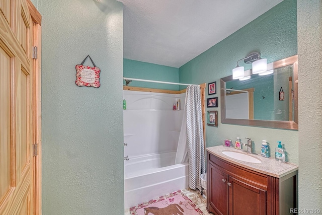 10199 W Cheyenne Cir, Salida, CO 81201 - bathroom with a textured wall, vanity, shower / bath combo, and toilet