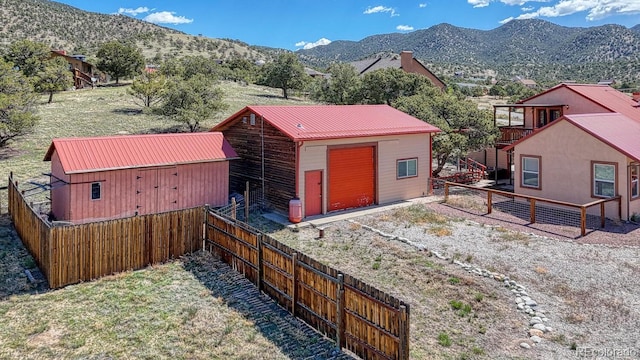 10199 W Cheyenne Cir, Salida, CO 81201 - exterior space with a mountain view and a fenced backyard