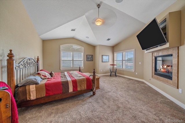 8655 E 130th Ave, Thornton, CO 80602 - carpeted bedroom with vaulted ceiling, a fireplace, and baseboards