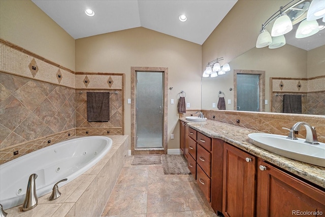 8655 E 130th Ave, Thornton, CO 80602 - bathroom with a stall shower, a whirlpool tub, double vanity, and vaulted ceiling