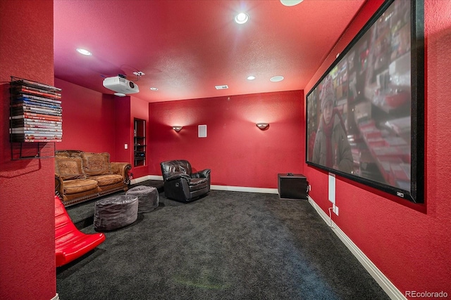 8655 E 130th Ave, Thornton, CO 80602 - home theater room featuring recessed lighting, carpet floors, baseboards, a textured wall, and a textured ceiling