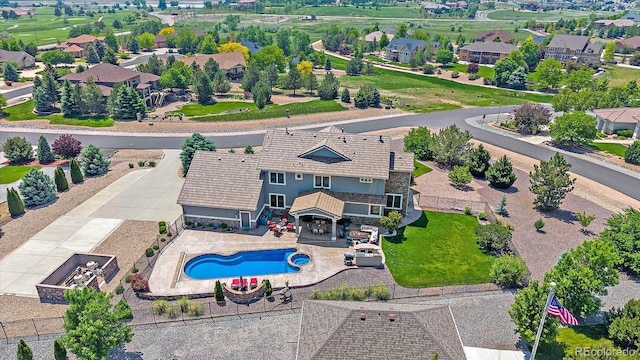 8655 E 130th Ave, Thornton, CO 80602 - aerial perspective of suburban area with a pool area