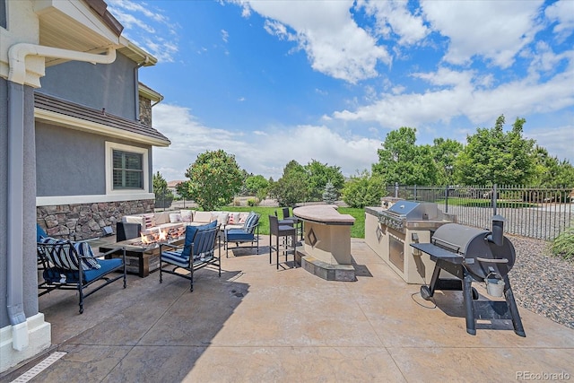 8655 E 130th Ave, Thornton, CO 80602 - view of patio / terrace with an outdoor living space with a fire pit