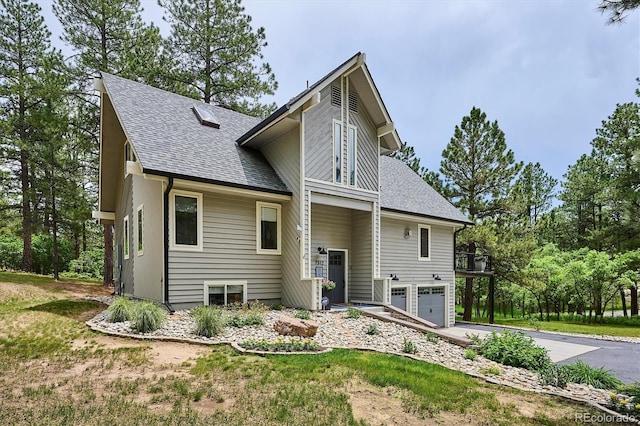 7312 Marshall Rd, Larkspur, CO 80118 - view of front of property with roof with shingles, a garage, and asphalt driveway