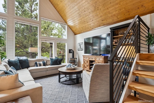 7312 Marshall Rd, Larkspur, CO 80118 - living room featuring high vaulted ceiling, a wood stove, wooden ceiling, and stairs