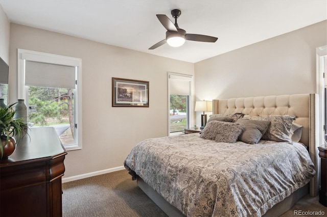 7312 Marshall Rd, Larkspur, CO 80118 - carpeted bedroom featuring multiple windows and a ceiling fan