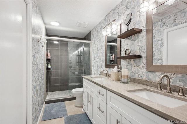 7312 Marshall Rd, Larkspur, CO 80118 - full bath featuring double vanity, a stall shower, and tile patterned flooring
