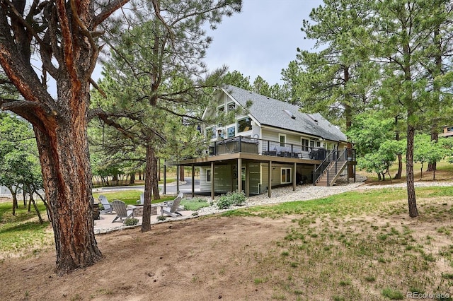 7312 Marshall Rd, Larkspur, CO 80118 - rear view of property featuring a wooden deck and stairway