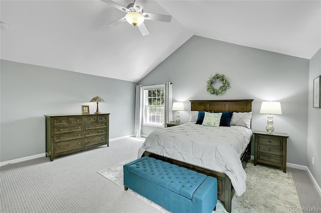 bedroom with light colored carpet, vaulted ceiling, ceiling fan, and baseboards