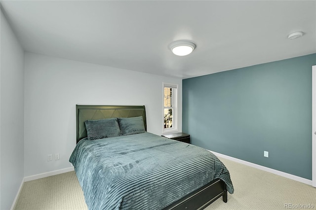carpeted bedroom with baseboards