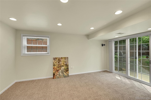 unfurnished room with carpet floors, recessed lighting, and baseboards