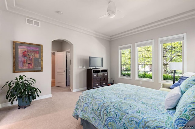 652 Ulster Way, Denver, CO 80230 - bedroom featuring arched walkways, carpet floors, baseboards, crown molding, and a ceiling fan