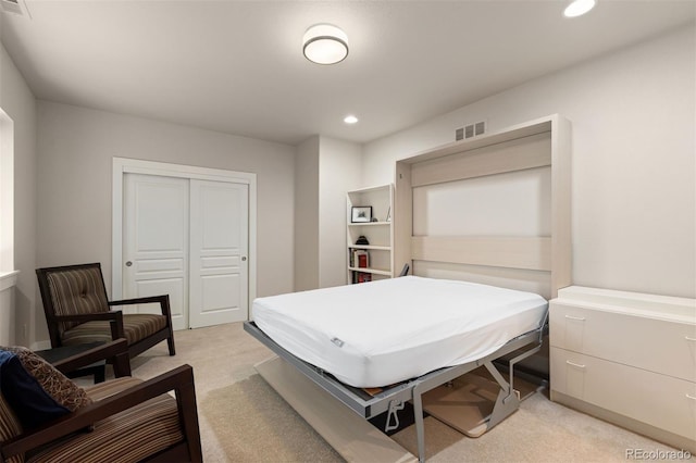 652 Ulster Way, Denver, CO 80230 - bedroom featuring light carpet, recessed lighting, and a closet