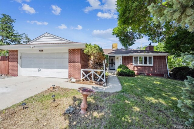3871 W Saratoga Ave, Littleton, CO 80123 - ranch-style home with brick siding, an attached garage, concrete driveway, and a chimney