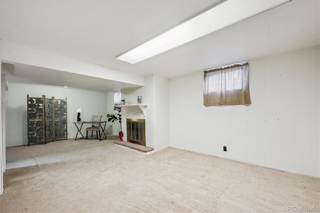 3871 W Saratoga Ave, Littleton, CO 80123 - below grade area with carpet floors and a glass covered fireplace