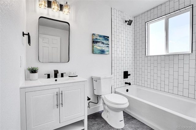 full bathroom with tile patterned flooring, vanity, tiled shower / bath combo, and toilet