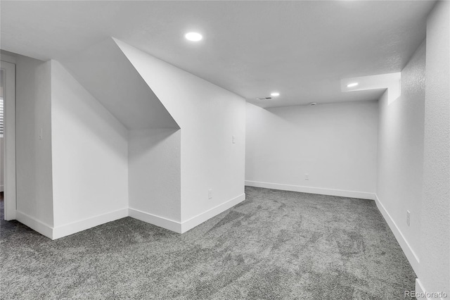 additional living space featuring carpet flooring