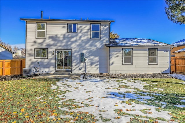 back of property featuring cooling unit, a yard, and a patio