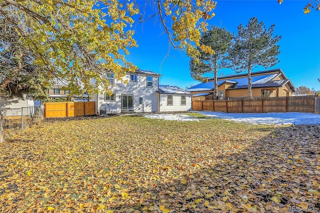 back of property featuring central AC unit