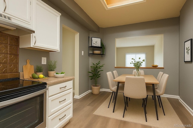 5555 E Briarwood Ave Unit 706, Centennial, CO 80122 - dining area with light wood-style flooring and baseboards