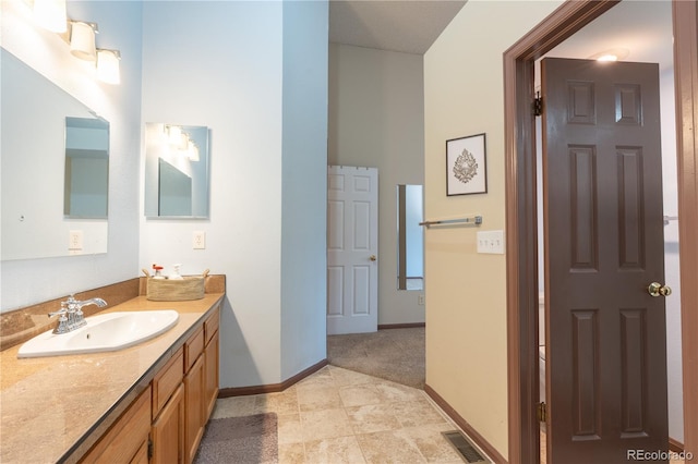 5555 E Briarwood Ave Unit 706, Centennial, CO 80122 - bathroom with baseboards and vanity