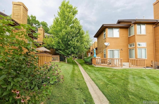 5555 E Briarwood Ave Unit 706, Centennial, CO 80122 - view of green lawn featuring a wooden deck