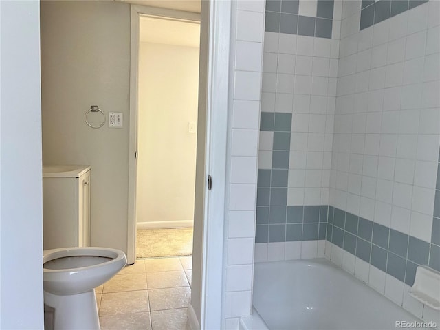 bathroom with tile patterned floors and tiled shower / bath combo