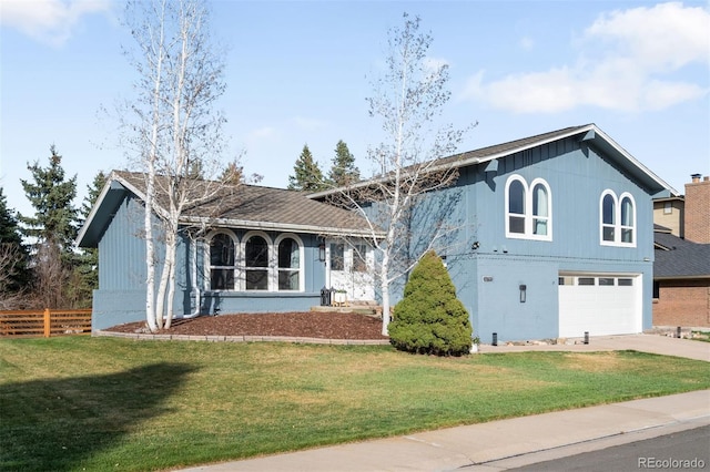 10795 E Powers Dr, Englewood, CO 80111 - view of front of home with driveway and an attached garage