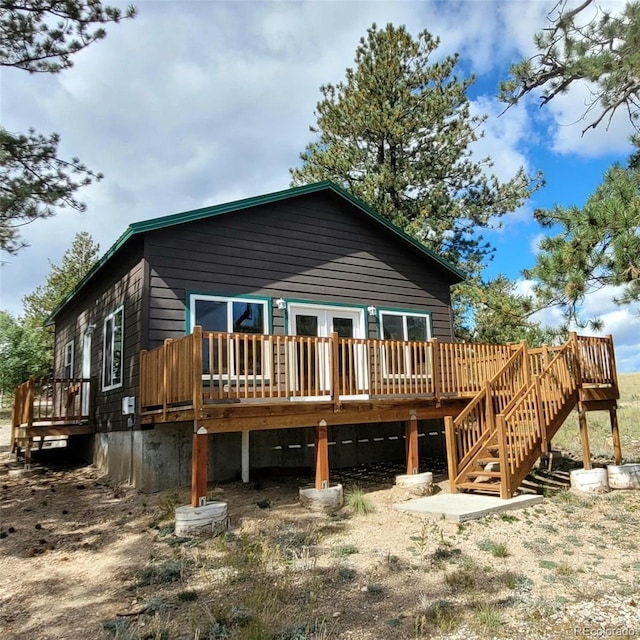 rear view of property with a deck