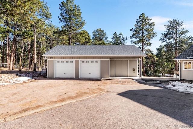 garage featuring driveway