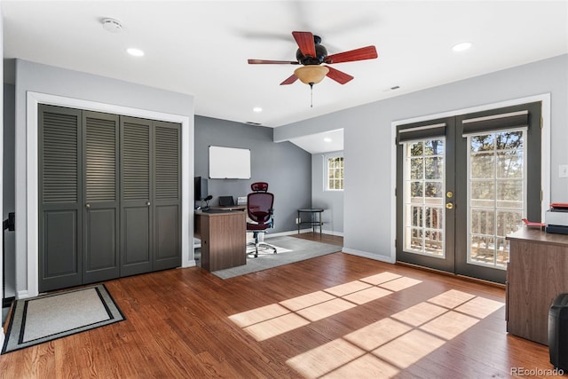 office with wood finished floors, recessed lighting, and french doors