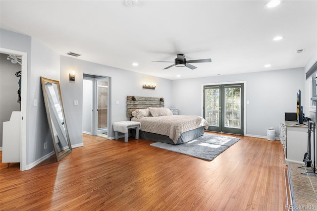 bedroom with recessed lighting, visible vents, light wood-type flooring, and access to outside