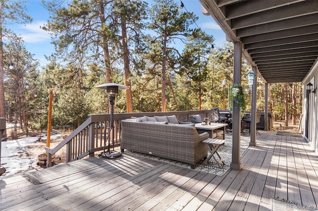 wooden terrace featuring outdoor lounge area