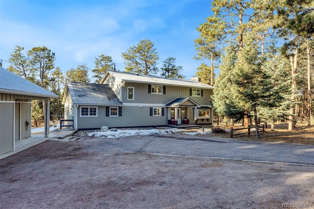 view of front of home featuring a chimney