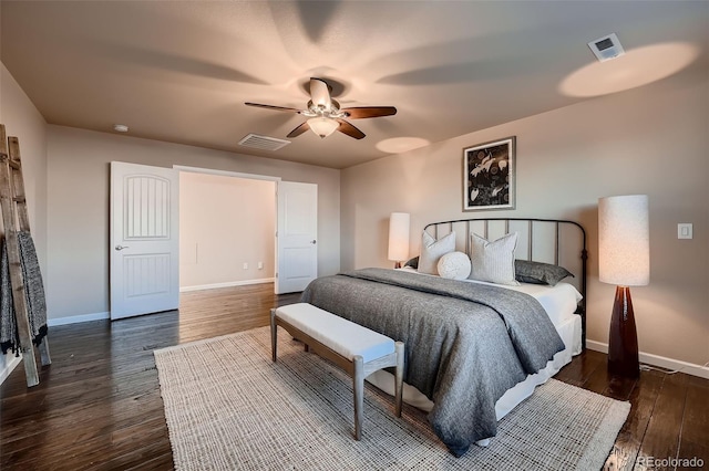 bedroom featuring baseboards, visible vents, ceiling fan, and dark wood-style flooring