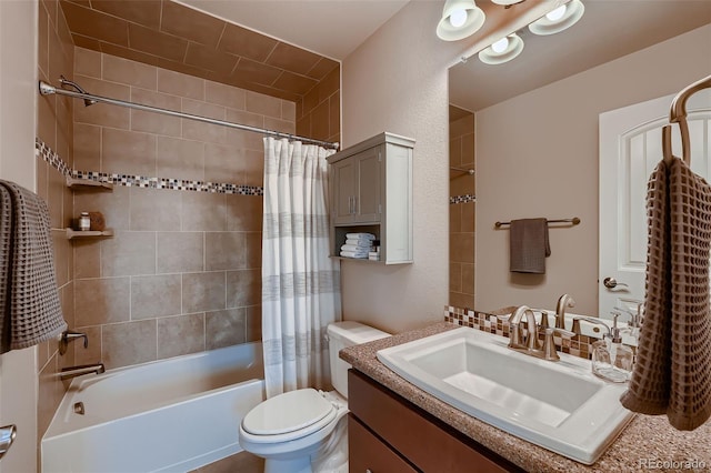 bathroom featuring shower / bath combo, vanity, and toilet