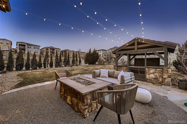 view of patio featuring an outdoor fire pit and a gazebo