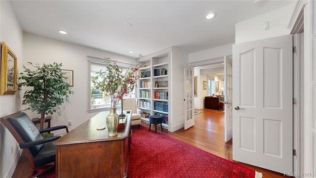home office with french doors, recessed lighting, and wood finished floors