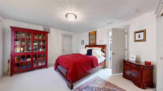 bedroom with visible vents, baseboards, and carpet floors
