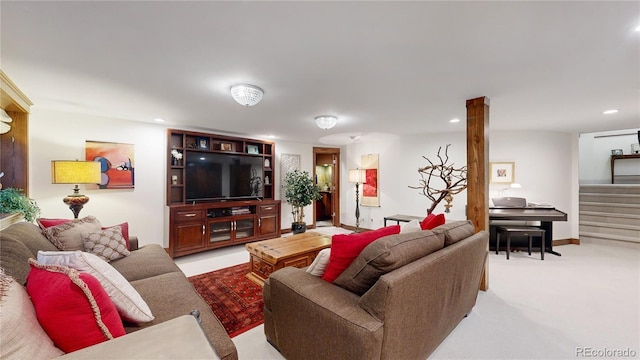 living room with light carpet, recessed lighting, and stairs