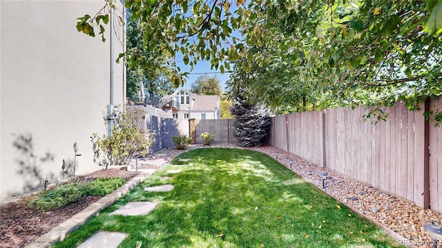 view of yard with a fenced backyard