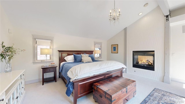 bedroom with lofted ceiling, a chandelier, light carpet, and a fireplace