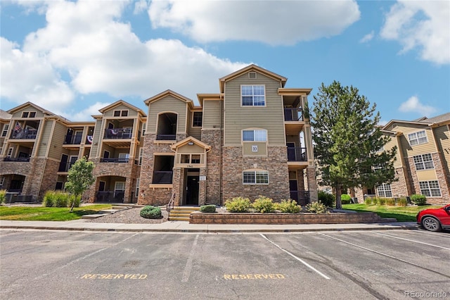 17442 Nature Walk Trl Unit 107, Parker, CO 80134 - view of apartment building / complex with uncovered parking