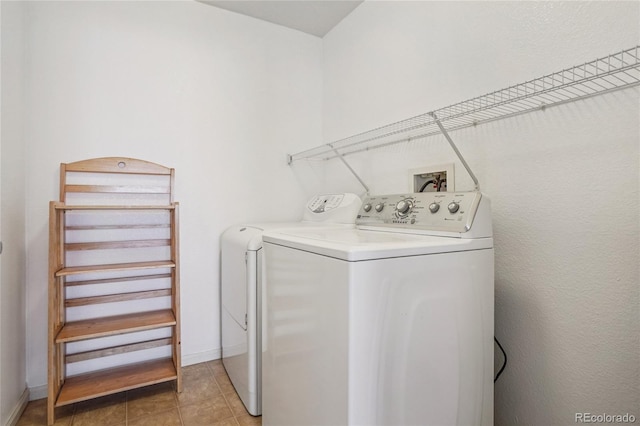 17442 Nature Walk Trl Unit 107, Parker, CO 80134 - laundry area with separate washer and dryer and light tile patterned floors